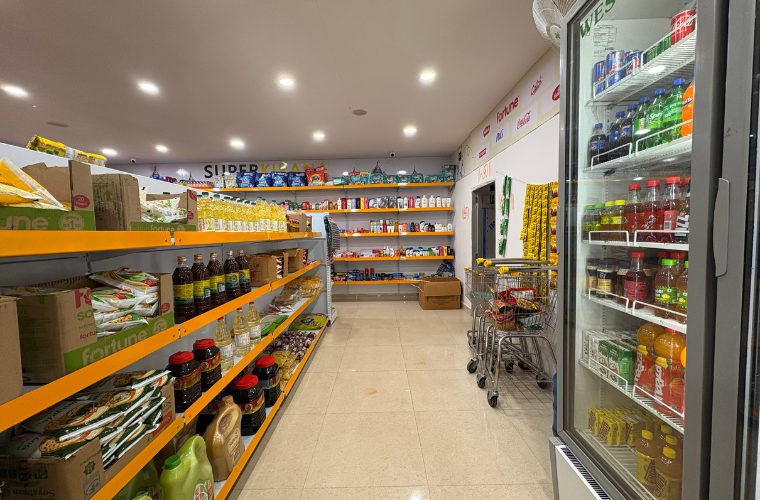 Modern SuperKirana supermarket layout showcasing spacious aisles, shelving, and lighting design